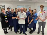 Mick Hibbs with his award 