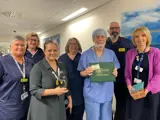 Eric Dray with his colleagues and daisy award 