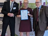 Kelly Smith with her award
